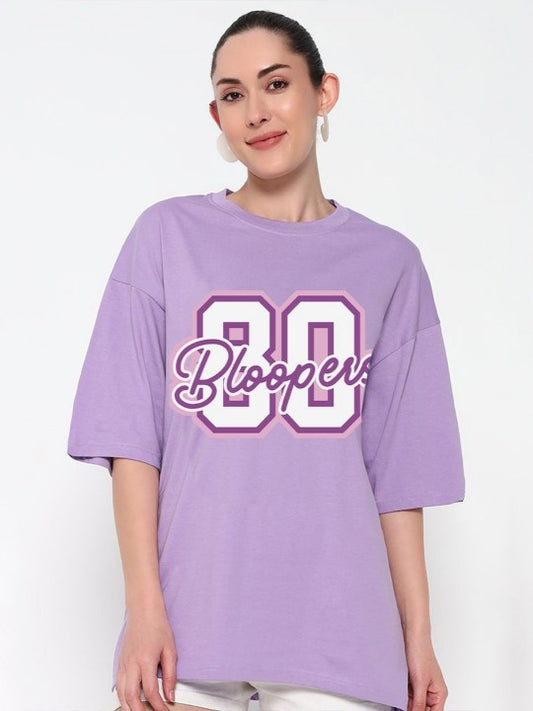 Woman wearing a purple oversized t-shirt with '80 Bloopers'