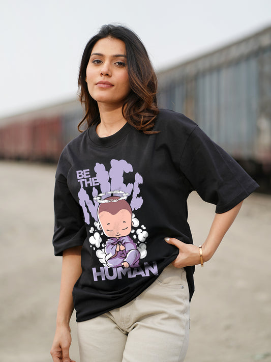Woman wearing a black t-shirt with a graphic design