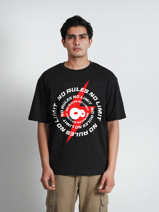 A man wearing a black oversized t-shirt