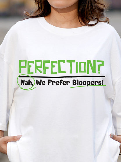 White t-shirt with green and black text 