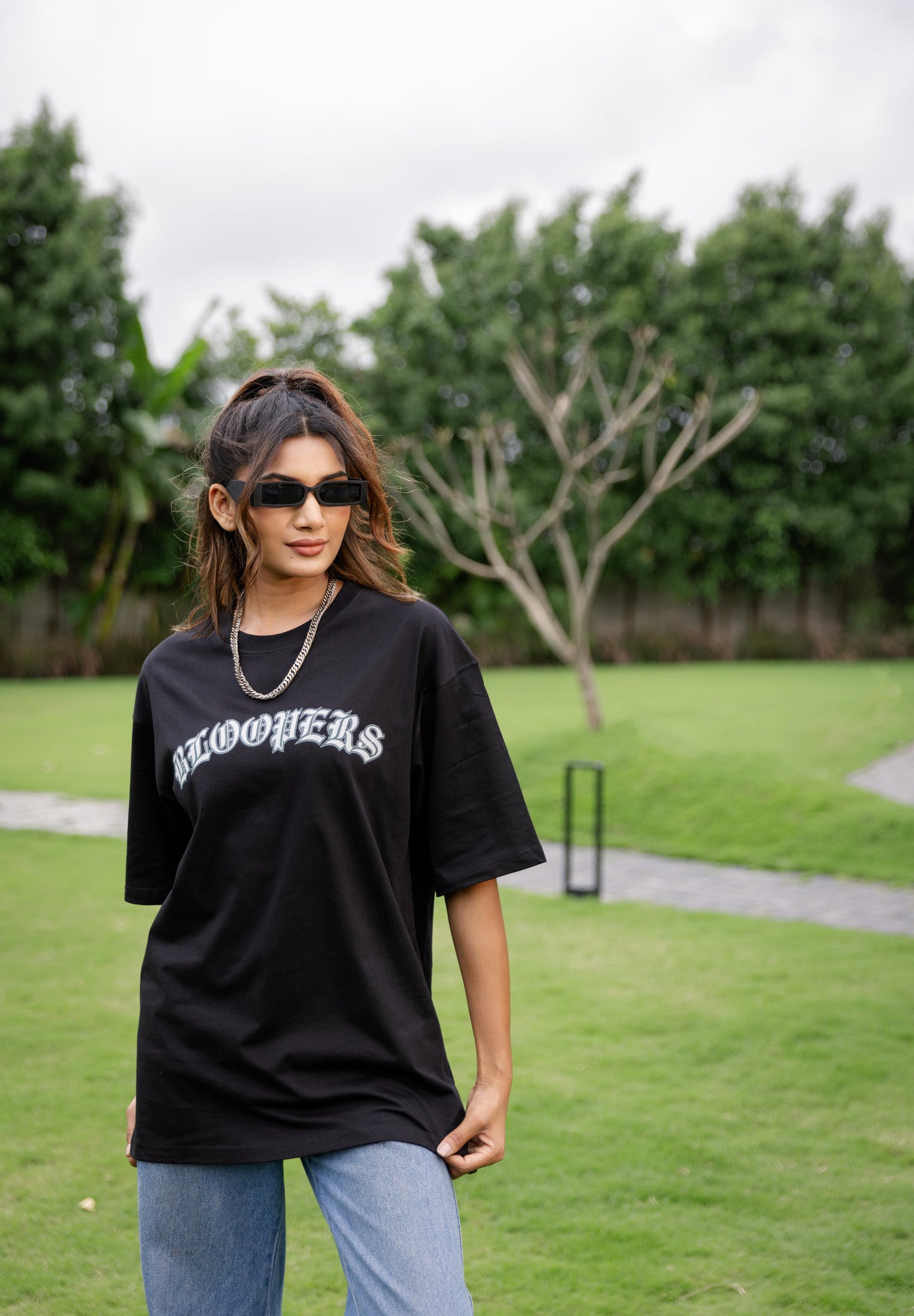 Woman wearing a black t-shirt with 'Bloomers' text 