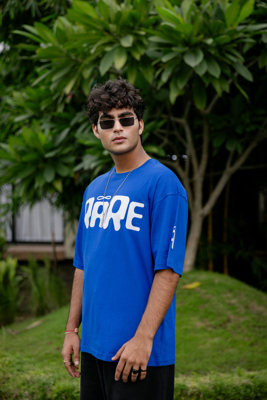 Man wearing a blue t-shirt with white text 