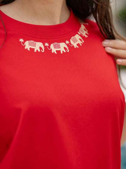 Red t-shirt with white elephant design 