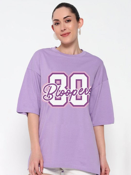 Woman wearing a purple oversized t-shirt with '80 Bloopers' 