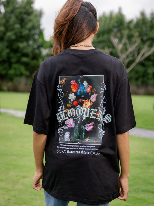 Girl wearing a black t-shirt with a colorful graphic design 
