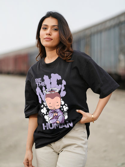 Woman wearing a black t-shirt with a graphic design 