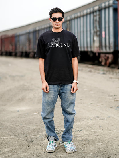 Man wearing a black t-shirt with 'UNBOUND' logo.
