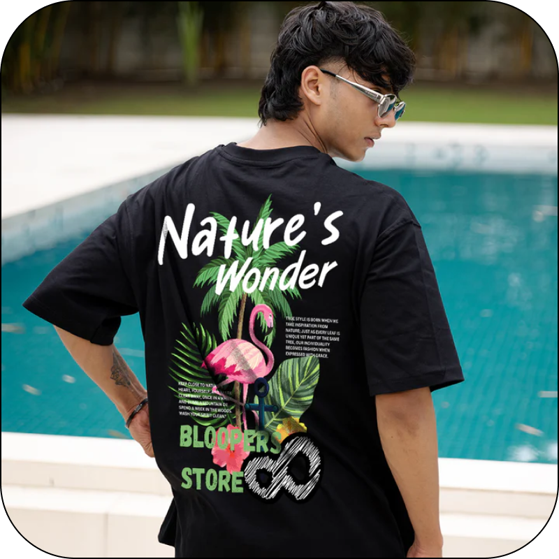 Person wearing a black t-shirt with 'Nature's Wonder' 
