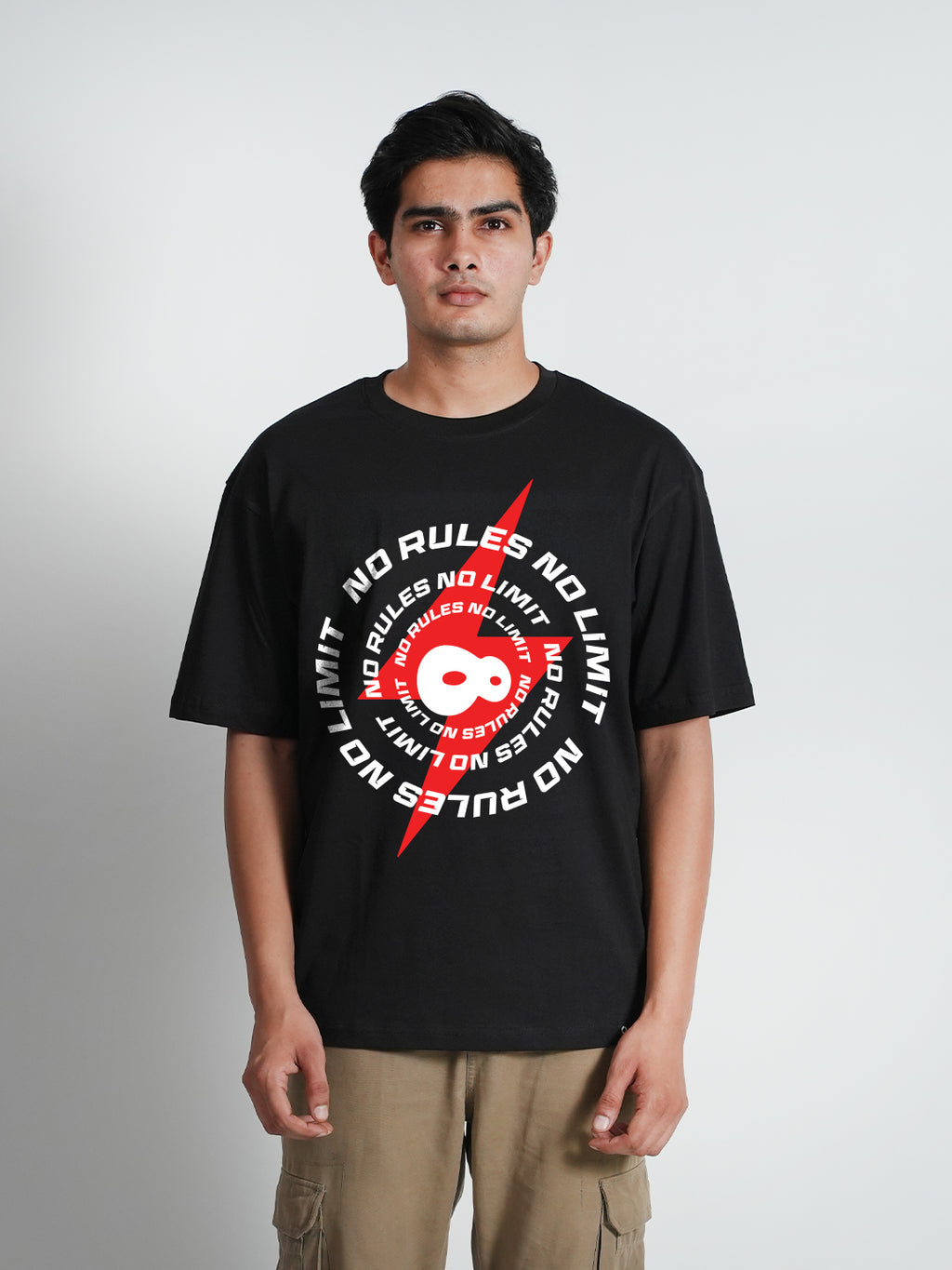 A man wearing a black oversized t-shirt 