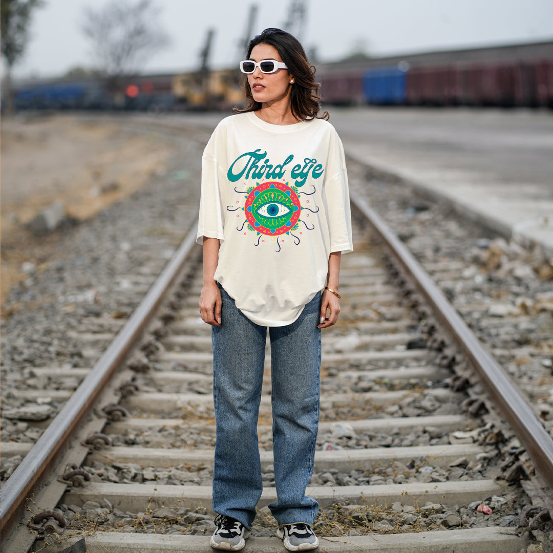 Person wearing a 'Third Eye' t-shirt on train tracks