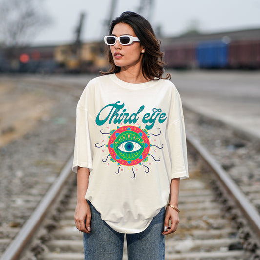 Woman wearing a 'Third Eye' t-shirt on train tracks