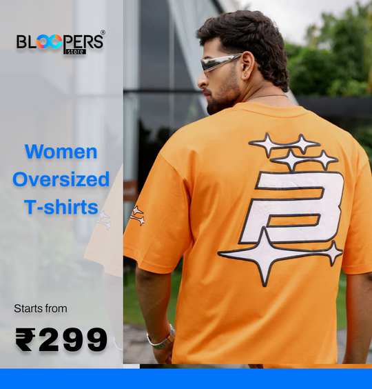 Man wearing an orange oversized t-shirt with promotional text