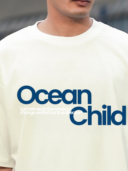 Person wearing a white t-shirt with 'Ocean Child' text in blue.