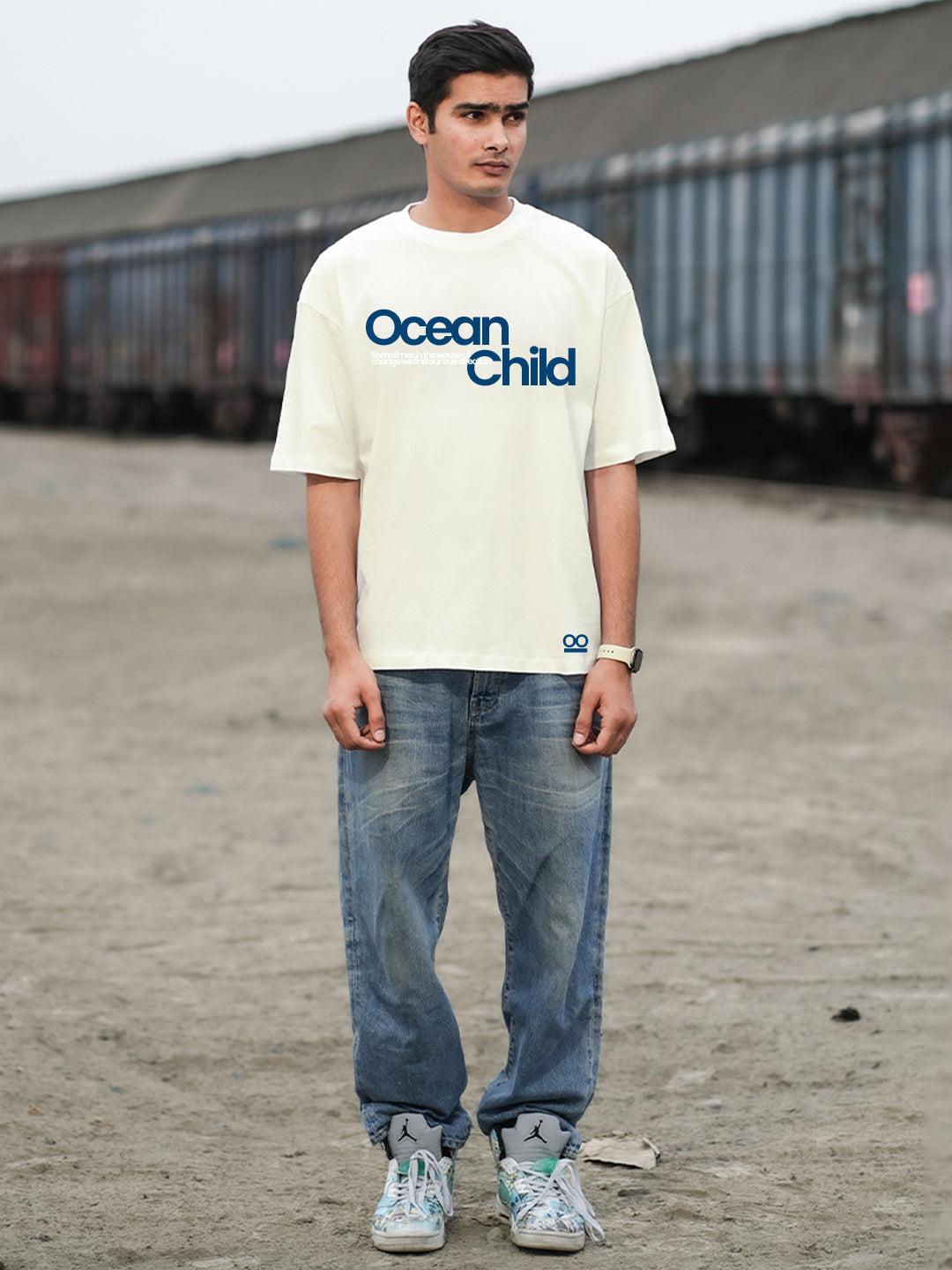 Person wearing a 'Ocean Child' t-shirt 