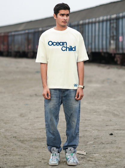 Person wearing a 'Ocean Child' t-shirt 