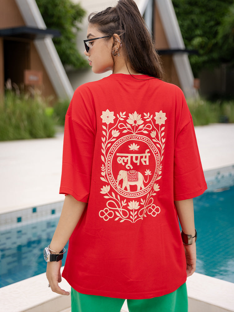 Girl wearing a red t-shirt with white design by a pool