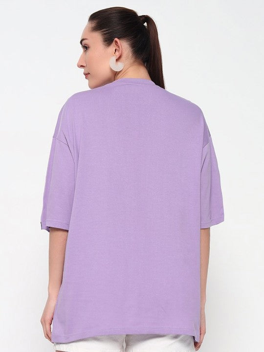 Woman wearing a purple top on a white background