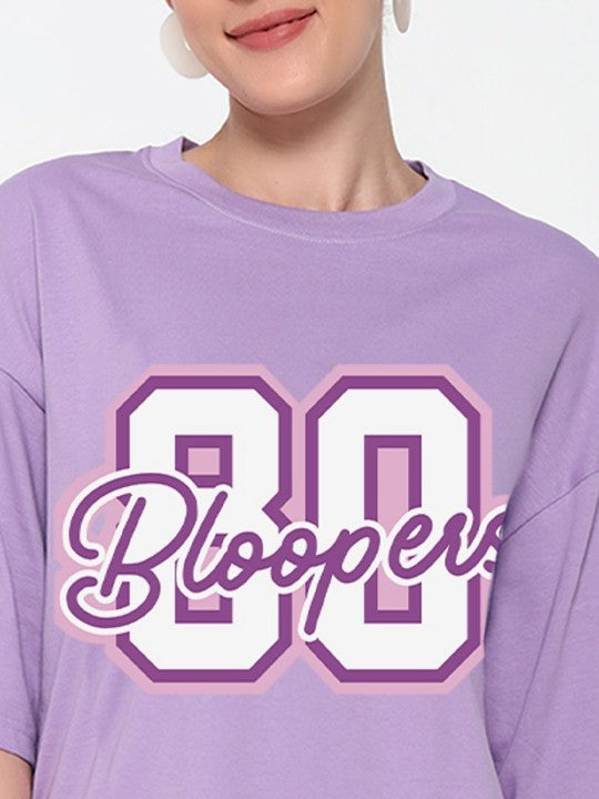 Person wearing a purple t-shirt with '80 Bloopers' text 